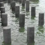 Brown Recycled Plastic Piles in water